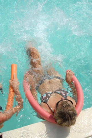 Aquaerobics into a heated swimming pool