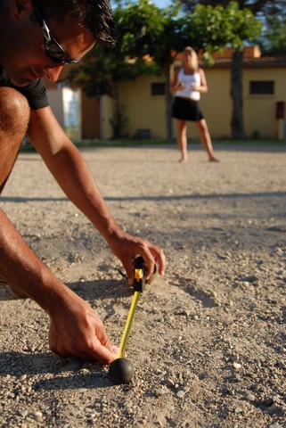 A match of petanque at the edge of the Mediterranean sea